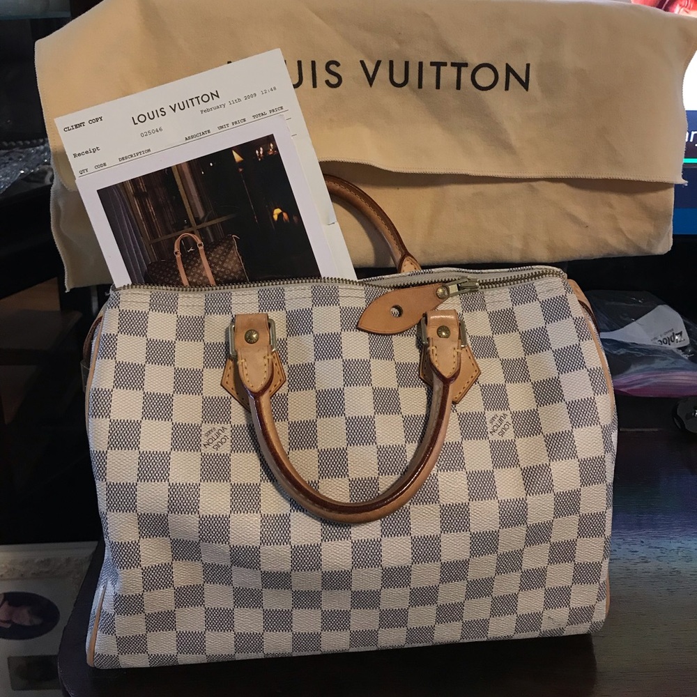 Louis Vuitton purse - moving sale. Make an offer.